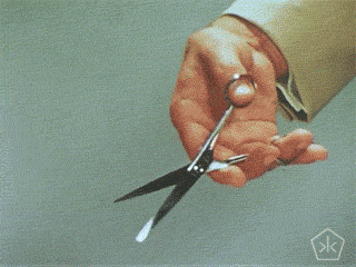 using scissors by a hand